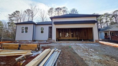 Custom-Built True Ranch by Ken Harvey Homes in Lake Royale-a on River Golf and Country Club at Lake Royale in North Carolina - for sale on GolfHomes.com, golf home, golf lot