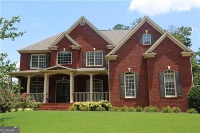 Discover the epitome of luxury living in this elegant on Brookstone Golf and Country Club in Georgia - for sale on GolfHomes.com, golf home, golf lot