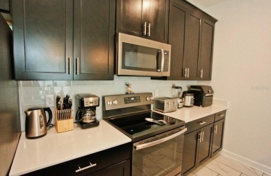 Fully furnished and decorated 4BR/3BA pool home in the on The Oasis Club at Champions Gate in Florida - for sale on GolfHomes.com, golf home, golf lot