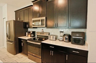 Fully furnished and decorated 4BR/3BA pool home in the on The Oasis Club at Champions Gate in Florida - for sale on GolfHomes.com, golf home, golf lot