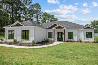 STUNNING MODERN LAKEFRONT HOME ON LAKE SINCLAIR! This sleek and on Milledgeville Country Club in Georgia - for sale on GolfHomes.com, golf home, golf lot