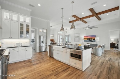 Prepare to be captivated by this luxurious lakefront masterpiece on Venetian Bay Golf Course in Florida - for sale on GolfHomes.com, golf home, golf lot
