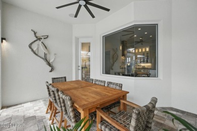 Prepare to be captivated by this luxurious lakefront masterpiece on Venetian Bay Golf Course in Florida - for sale on GolfHomes.com, golf home, golf lot