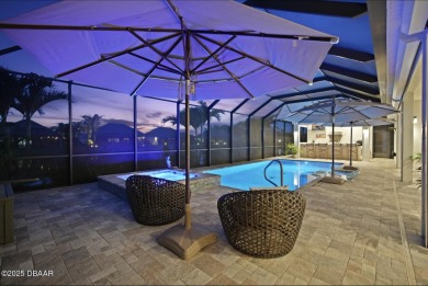 Prepare to be captivated by this luxurious lakefront masterpiece on Venetian Bay Golf Course in Florida - for sale on GolfHomes.com, golf home, golf lot