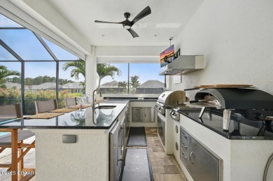 Prepare to be captivated by this luxurious lakefront masterpiece on Venetian Bay Golf Course in Florida - for sale on GolfHomes.com, golf home, golf lot