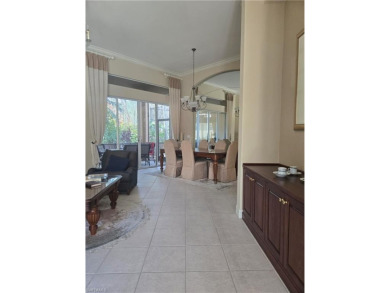 Enter through a private entrance to a peacefully courtyard with on Kensington Golf and Country Club in Florida - for sale on GolfHomes.com, golf home, golf lot