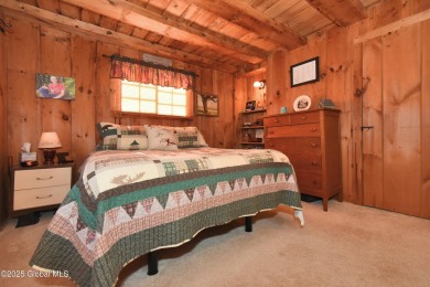 This charming cottage with approx 250 feet of direct water front on Bend Of The River Golf Course in New York - for sale on GolfHomes.com, golf home, golf lot