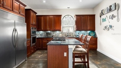 Welcome to a one-of-a-kind Mediterranean masterpiece tucked on Wedgefield Golf Club in Florida - for sale on GolfHomes.com, golf home, golf lot