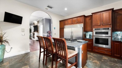 Welcome to a one-of-a-kind Mediterranean masterpiece tucked on Wedgefield Golf Club in Florida - for sale on GolfHomes.com, golf home, golf lot