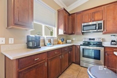 Check out this stunning private corner unit with a screened on Peninsula Golf and Racquet Club in Alabama - for sale on GolfHomes.com, golf home, golf lot