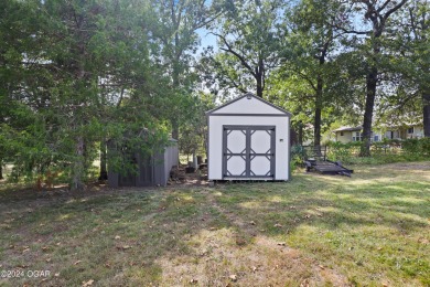 Discover the charm of Briarbrook in this delightful 3-bedroom on Briarbrook Golf Course in Missouri - for sale on GolfHomes.com, golf home, golf lot