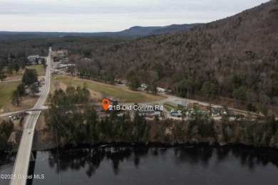 This charming cottage with approx 250 feet of direct water front on Bend Of The River Golf Course in New York - for sale on GolfHomes.com, golf home, golf lot