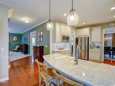Beautiful home in Wakefield backing up to the executive golf on TPC at Wakefield Plantation in North Carolina - for sale on GolfHomes.com, golf home, golf lot