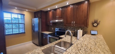 Beautifully renovated 2 bedroom 2 bath condo overlooking on Palm-Aire Country Club and Resort - Palms in Florida - for sale on GolfHomes.com, golf home, golf lot