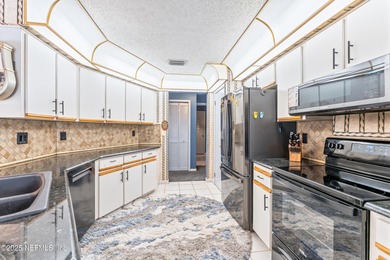 Beautiful 3-bedroom, 2-bath home offering an open layout and on The Grand Club Cypress Course in Florida - for sale on GolfHomes.com, golf home, golf lot