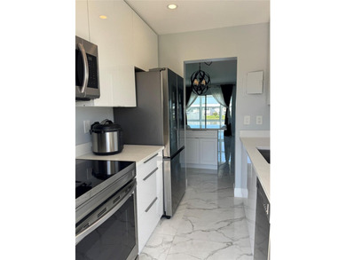 Beautifully Upgraded 2nd floor 2bedroom 2 Bath condo. Corner on Leisureville Community Association in Florida - for sale on GolfHomes.com, golf home, golf lot