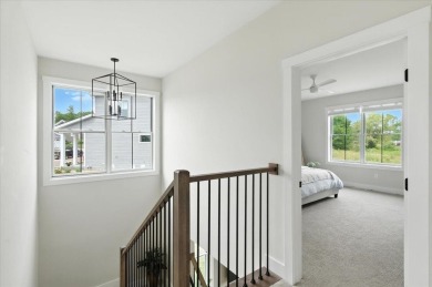 Enjoy refined living in this exquisitely crafted townhome in the on Kwiniaska Golf Club in Vermont - for sale on GolfHomes.com, golf home, golf lot