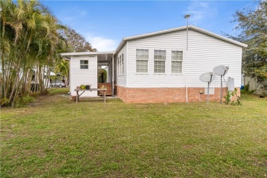 This charming home has been meticulously maintained, showcasing on Barefoot Bay Golf Course in Florida - for sale on GolfHomes.com, golf home, golf lot