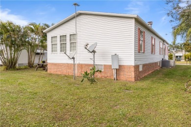 This charming home has been meticulously maintained, showcasing on Barefoot Bay Golf Course in Florida - for sale on GolfHomes.com, golf home, golf lot