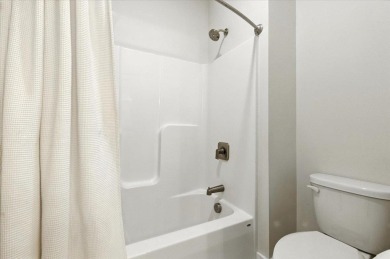 Enjoy refined living in this exquisitely crafted townhome in the on Kwiniaska Golf Club in Vermont - for sale on GolfHomes.com, golf home, golf lot