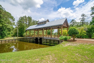 Experience luxury living at its finest in this exquisite on River Landing Golf Course in North Carolina - for sale on GolfHomes.com, golf home, golf lot