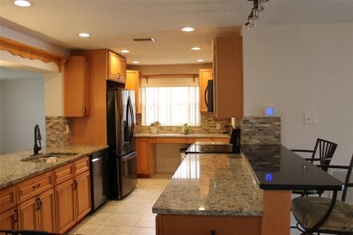 This is a very special remodeled, Drayton, single family home on Mainlands Golf Club in Florida - for sale on GolfHomes.com, golf home, golf lot