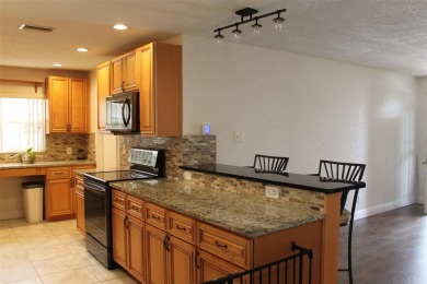 This is a very special remodeled, Drayton, single family home on Mainlands Golf Club in Florida - for sale on GolfHomes.com, golf home, golf lot