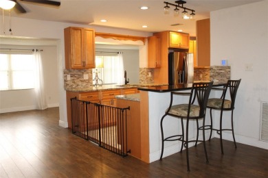 This is a very special remodeled, Drayton, single family home on Mainlands Golf Club in Florida - for sale on GolfHomes.com, golf home, golf lot