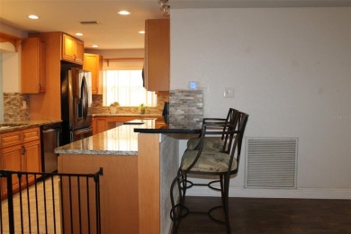 This is a very special remodeled, Drayton, single family home on Mainlands Golf Club in Florida - for sale on GolfHomes.com, golf home, golf lot