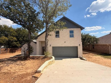 Don't miss this opportunity! This two-story, 4-bedroom, 3-bath on Holiday Hills Country Club in Texas - for sale on GolfHomes.com, golf home, golf lot