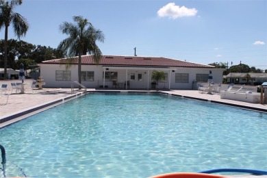 This is a very special remodeled, Drayton, single family home on Mainlands Golf Club in Florida - for sale on GolfHomes.com, golf home, golf lot