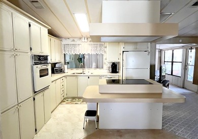 This pretty home is waiting for someone to give it some love on Del Tura Golf and Country Club in Florida - for sale on GolfHomes.com, golf home, golf lot