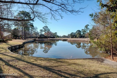 ***NEW PHOTOS. Breath taking views over the pond behind the on Country Club of Landfall in North Carolina - for sale on GolfHomes.com, golf home, golf lot
