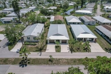 Beautifully Maintained 2-bed, 2-bath home in the welcoming 55+ on Spanish Lakes I in Florida - for sale on GolfHomes.com, golf home, golf lot