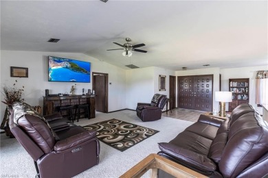 Wake up to sweeping golf course views in this distinctive on Palmetto-Pine Country Club in Florida - for sale on GolfHomes.com, golf home, golf lot