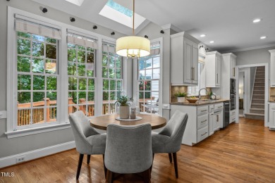 Nestled on a desirable corner lot, surrounded by mature trees in on Devils Ridge Golf Club in North Carolina - for sale on GolfHomes.com, golf home, golf lot