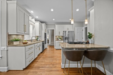 Nestled on a desirable corner lot, surrounded by mature trees in on Devils Ridge Golf Club in North Carolina - for sale on GolfHomes.com, golf home, golf lot