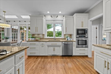 Nestled on a desirable corner lot, surrounded by mature trees in on Devils Ridge Golf Club in North Carolina - for sale on GolfHomes.com, golf home, golf lot