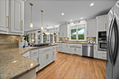 Nestled on a desirable corner lot, surrounded by mature trees in on Devils Ridge Golf Club in North Carolina - for sale on GolfHomes.com, golf home, golf lot