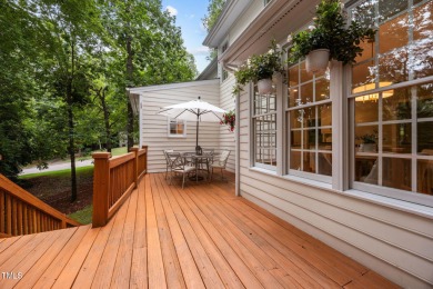 Nestled on a desirable corner lot, surrounded by mature trees in on Devils Ridge Golf Club in North Carolina - for sale on GolfHomes.com, golf home, golf lot