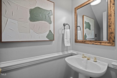 Nestled on a desirable corner lot, surrounded by mature trees in on Devils Ridge Golf Club in North Carolina - for sale on GolfHomes.com, golf home, golf lot