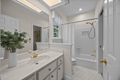 Nestled on a desirable corner lot, surrounded by mature trees in on Devils Ridge Golf Club in North Carolina - for sale on GolfHomes.com, golf home, golf lot