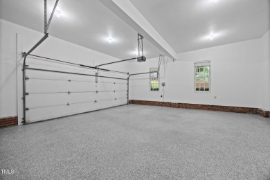 Nestled on a desirable corner lot, surrounded by mature trees in on Devils Ridge Golf Club in North Carolina - for sale on GolfHomes.com, golf home, golf lot