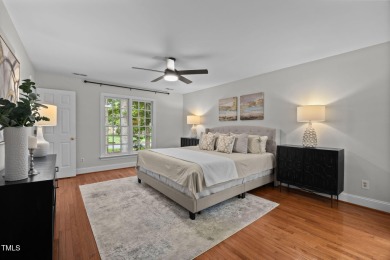 Nestled on a desirable corner lot, surrounded by mature trees in on Devils Ridge Golf Club in North Carolina - for sale on GolfHomes.com, golf home, golf lot