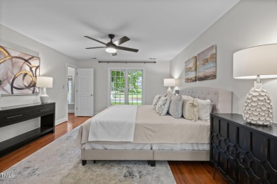 Nestled on a desirable corner lot, surrounded by mature trees in on Devils Ridge Golf Club in North Carolina - for sale on GolfHomes.com, golf home, golf lot