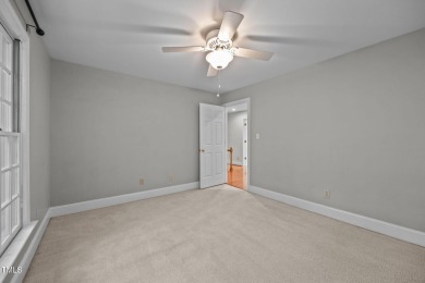 Nestled on a desirable corner lot, surrounded by mature trees in on Devils Ridge Golf Club in North Carolina - for sale on GolfHomes.com, golf home, golf lot