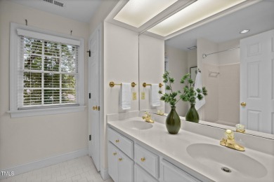 Nestled on a desirable corner lot, surrounded by mature trees in on Devils Ridge Golf Club in North Carolina - for sale on GolfHomes.com, golf home, golf lot