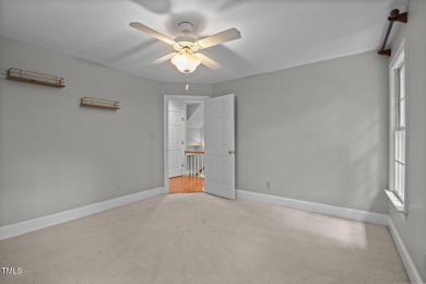 Nestled on a desirable corner lot, surrounded by mature trees in on Devils Ridge Golf Club in North Carolina - for sale on GolfHomes.com, golf home, golf lot
