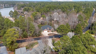 Take in peaceful views of Lake Pinehurst at this inviting, all on Pinehurst Resort and Country Club in North Carolina - for sale on GolfHomes.com, golf home, golf lot