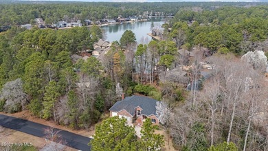 Take in peaceful views of Lake Pinehurst at this inviting, all on Pinehurst Resort and Country Club in North Carolina - for sale on GolfHomes.com, golf home, golf lot